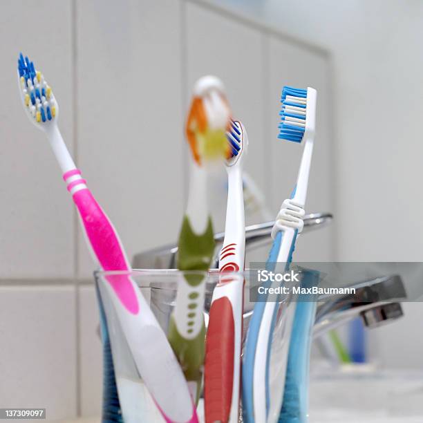 Toothbrushes In The Bathroom Stock Photo - Download Image Now - Domestic Bathroom, Plastic, Bathroom
