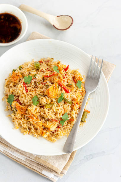 istock Non Vegetarian Fried Rice in a Plate on White Background Directly Above Vertical Photo 1373092206