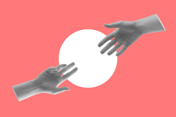 istock Two hands reach out to each other. 1373094150