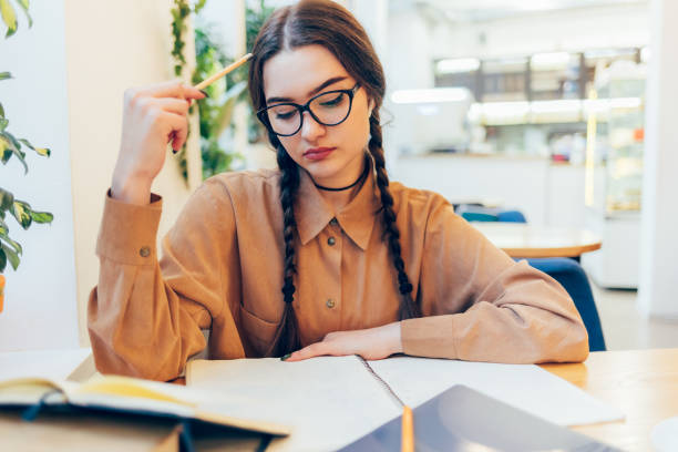 istock Portrait thoughtful female student studying 1373103329