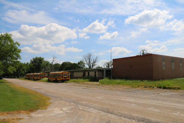 abandoned rural town school education building pandemic closure buses dirt road editorial closed small town disaster scene stock photo