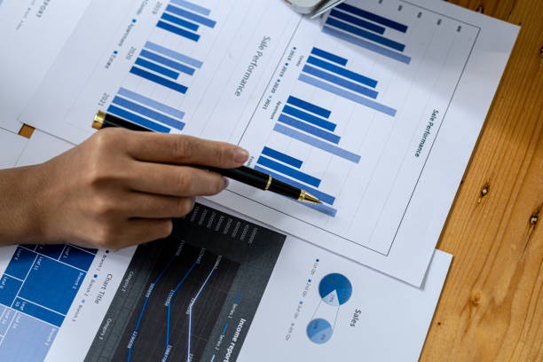 istock Business men are looking at the company's financial documents to analyze problems and find solutions before bringing the information to a meeting with a partner. Financial concept. 1373117123
