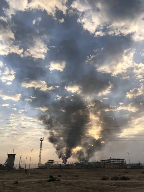 istock Air pollution, black smoke at sunset 1373118671