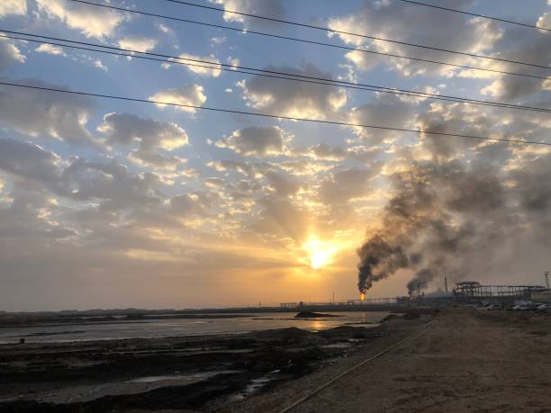 istock Air pollution, black smoke coming from a flare for flaring associated gas 1373118747