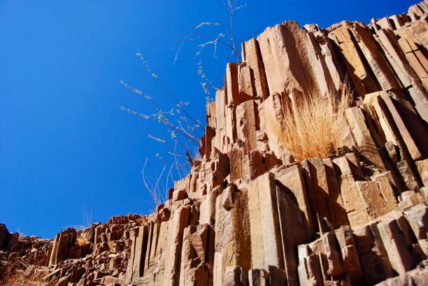 Twyfelfontein, officially known as ǀUi-ǁAis, is a site of ancient rock engravings in the Kunene Region of north-western Namibia. It consists of a spring in a valley flanked by the slopes of a sandstone table mountain that receives very little rainfall and has a wide range of diurnal temperatures.