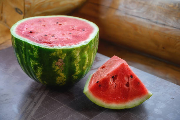 istock A ripe watermelon with a part cut off from it lies on the table 1373120844