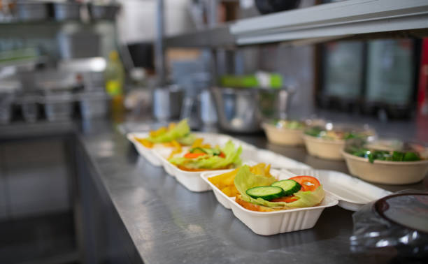 istock Meals in containers prepared for take away in kitchen restaurant. 1373121053