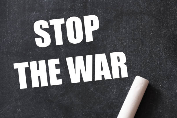 istock STOP THE WAR words on a black chalk board. 1373121213