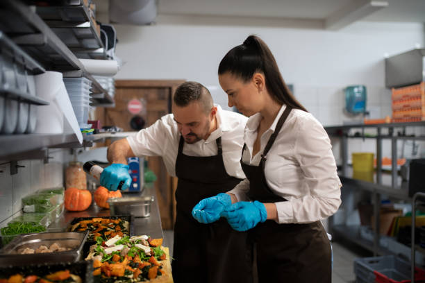 istock Chef and cook working on their dishes indoors in restaurant kitchen. 1373121288