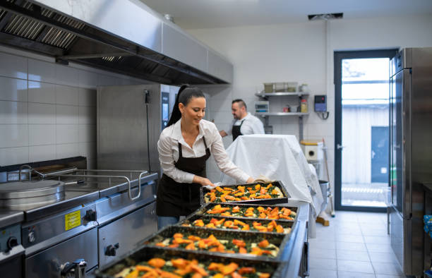 istock Chef and cook working on their dishes indoors in restaurant kitchen. 1373121298