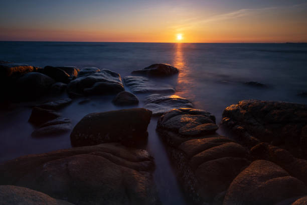 istock Motion seascape with stone arch at sunset, Rayong 1373122540