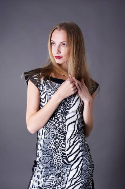 istock Young beautiful blond woman over grey 1373124472