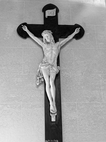 Stone crucifix inside a mausoleum