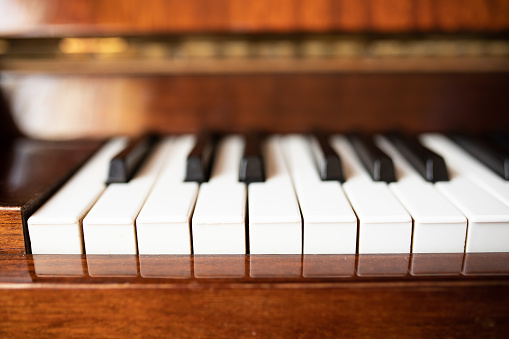 Old piano on sunny day