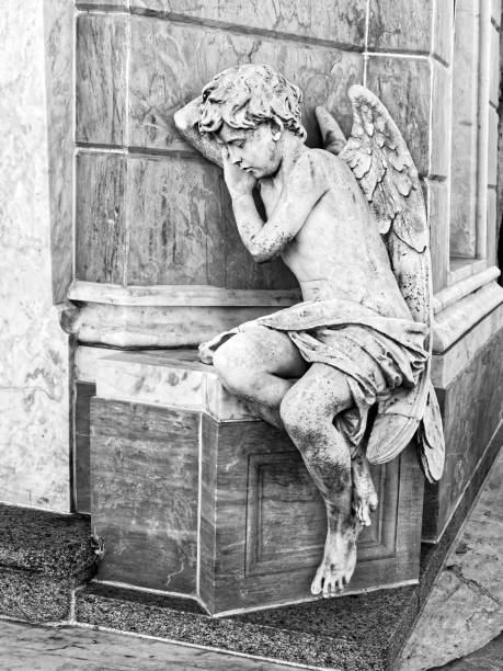 Angel Statue Angel status inside cemetery winged cherub stock pictures, royalty-free photos & images