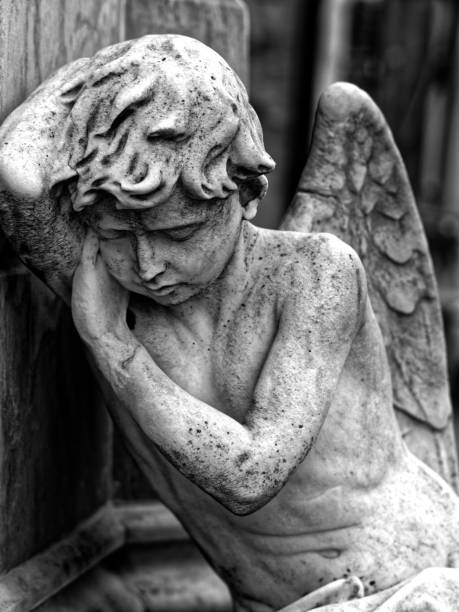 Angel Statue Angel status inside cemetery winged cherub stock pictures, royalty-free photos & images