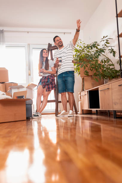 istock Couple drinking coffee while planning home redecoration 1373127220