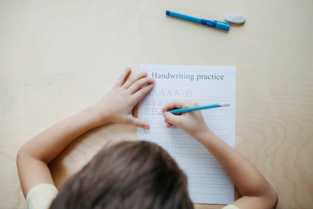 istock A schoolboy doing math lesson sitting at desk in the children room 1373129838