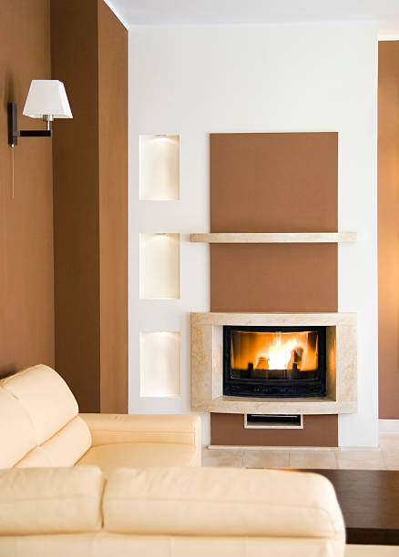 Modern fireplace Contemporary fireplace corner, warm colors. drywall fireplace stock pictures, royalty-free photos & images