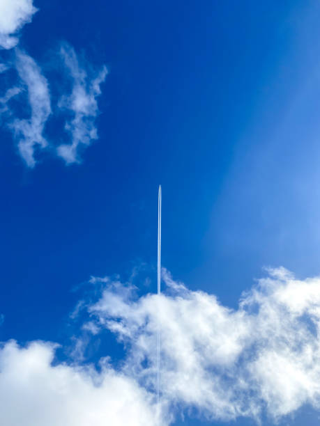 istock Large plane flies in the blue sky 1373131985