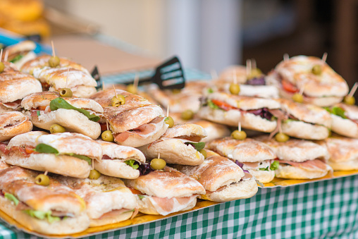 Sandwiches with olives and ham at a market