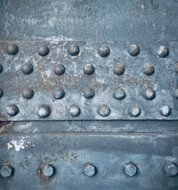 istock background closeup rivets on rusty old steel beam 1373136852