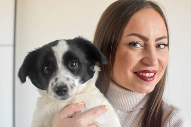 istock Woman and puppy indoors 1373140057
