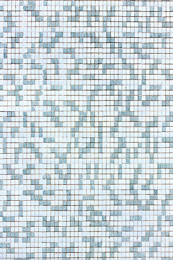 Small blue, gray and white square shaped tiles background, full frame vertical view, mosaic background, traditional gresite. Pontevedra province, Galicia, Spain.