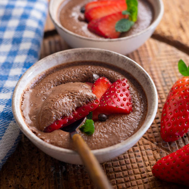 istock Chocolate mousse with pieces of fresh strawberry. 1373143101