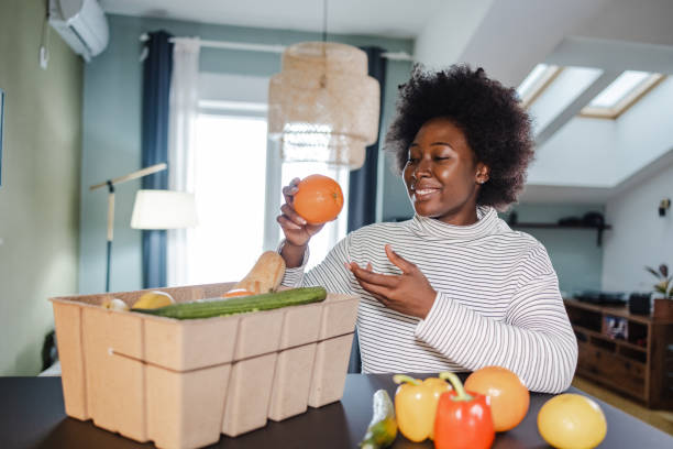 istock Unpacking fresh organic food at home 1373143290