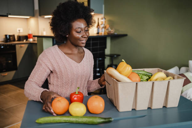 istock Unpacking fresh organic food at home 1373143541