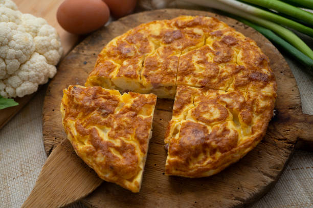 istock Traditional Spanish omelette with cabbage and Iberian ham. 1373144325