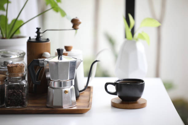 istock Aluminium moka pot and black coffee cup with coffee stuffs 1373144439