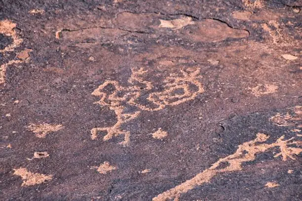 Photo of Petroglyphs Rock Paintings St George Utah on Land Hill from Ancestral Puebloan and Southern Paiute Native Americans thousands of years old on Sandstone. USA.