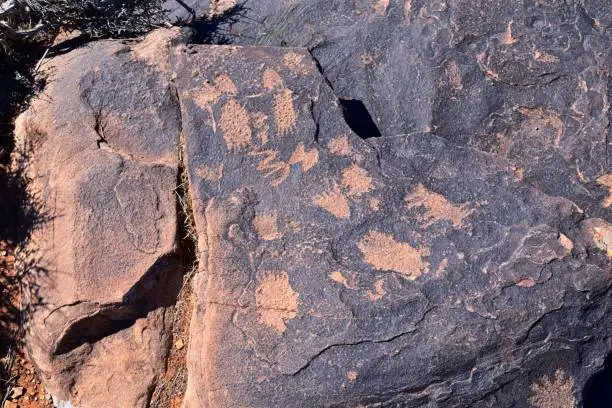 Photo of Petroglyphs Rock Paintings St George Utah on Land Hill from Ancestral Puebloan and Southern Paiute Native Americans thousands of years old on Sandstone. USA.