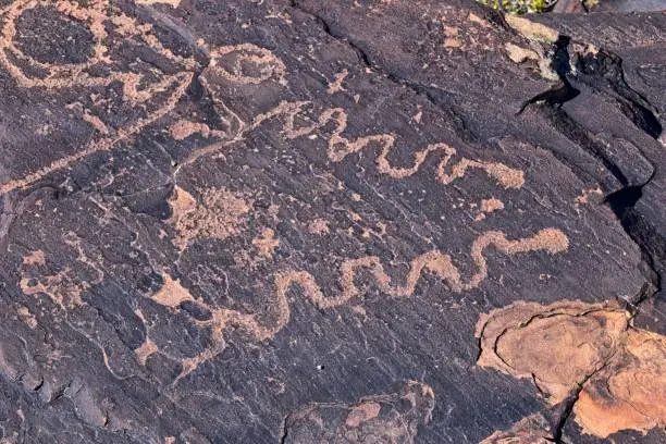 Photo of Petroglyphs Rock Paintings St George Utah on Land Hill from Ancestral Puebloan and Southern Paiute Native Americans thousands of years old on Sandstone. USA.