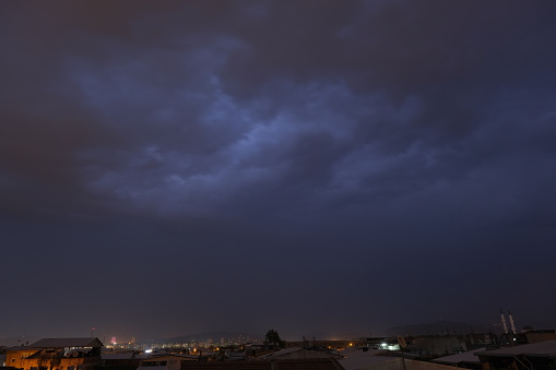 Rainy and stormy weather, light and lightning and flash at cloudscape at night in Bursa