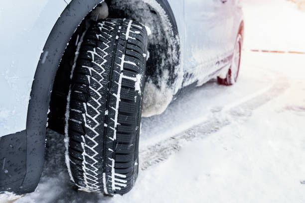 istock Close up of a snow tyre fitted on a car 1373146836