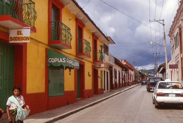 San Cristobal de Las Casas, Mexico - aug 18, 1998: low colored houses line the streets of San Cristobal. This simple colonial architecture is typical of all colonial cities in Central America