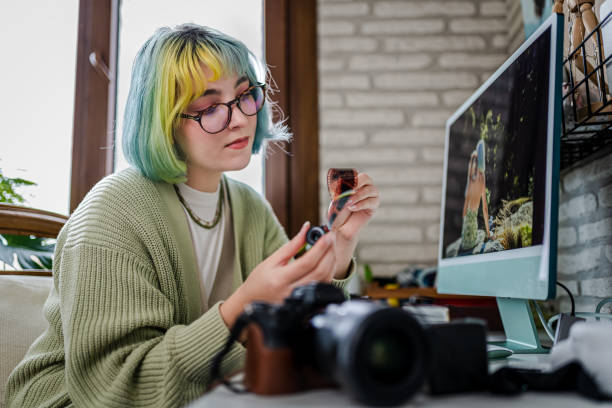 istock Millennial photographer working on her photos at home office 1373147247