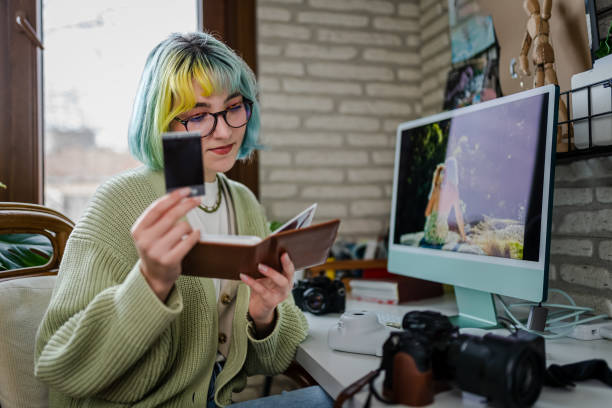 istock Millennial photographer working on her photos at home office 1373147319