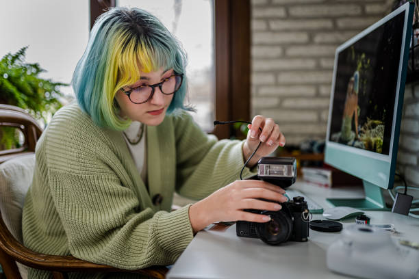 istock Millennial photographer working on her photos at home office 1373147421