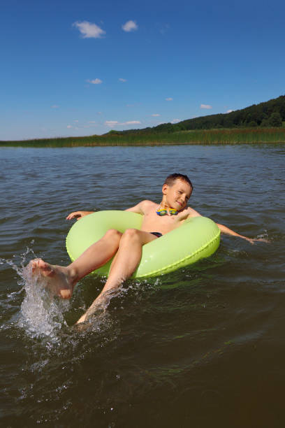 istock A child swims in the summer with a circle. 1373147438