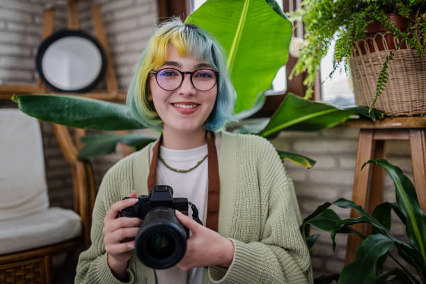 Portrait of a Young smiling Photographer Portrait of a Young smiling Photographer photo editor photos stock pictures, royalty-free photos & images