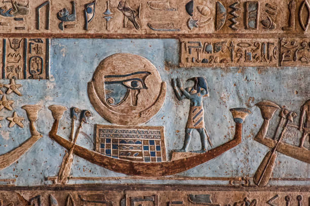 Egyptian hierogryphs from Dendara Temple, Egypt Egyptian hierogryphs from Dendara Temple, Egypt, displaying the eye of Horus and egyptian god in a boat hieroglyphics photos stock pictures, royalty-free photos & images