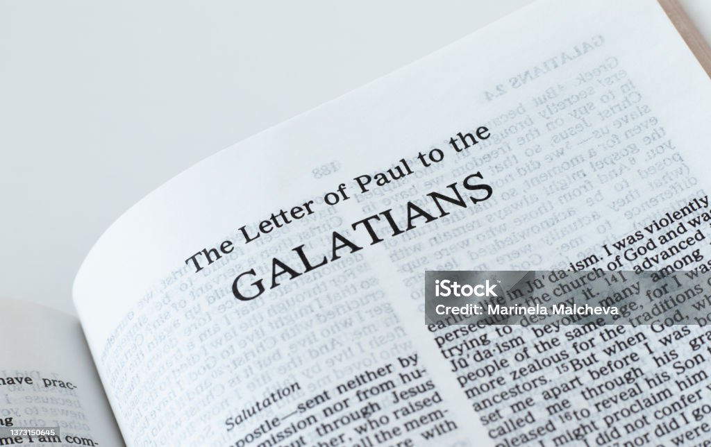 Galatians open Holy Bible Book isolated on white background Galatians open Holy Bible Book isolated on white background. A close-up. New Testament Scripture. Studying the Word of God Jesus Christ. Christian biblical concept of faith, hope, and trust. Apostle - Worshipper Stock Photo