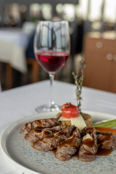 istock Eating steak with a glass of wine on dinner 1373153977