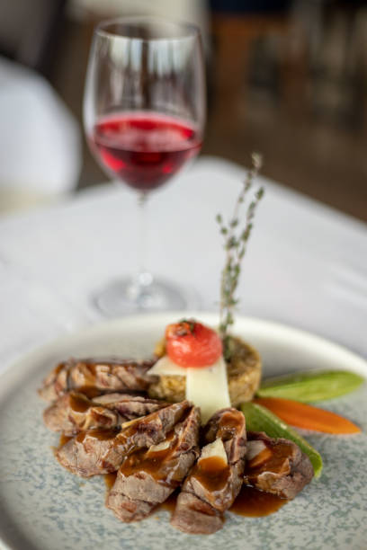 istock Eating steak with a glass of wine on dinner 1373154031