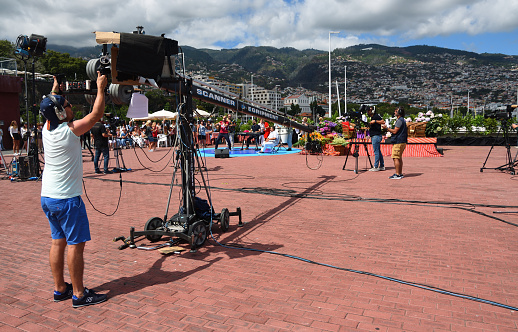 Funchal, Madeira, Portugal - July  01, 2019: Large boom arm being used for TV Filming of group performing at the opening of CR7 Hotel in Funchal.