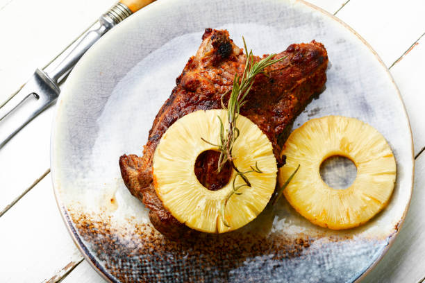 Meat baked with pineapple rings.